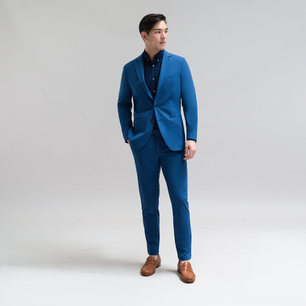 Bespoke custom athleisure technical athletic stretch suit los angeles model Jesse in Italian Blue