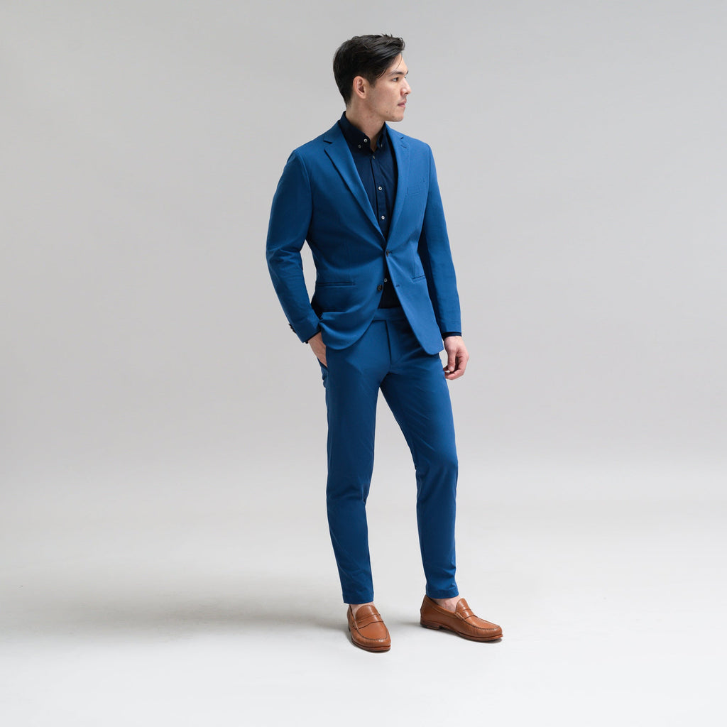 Bespoke custom athleisure technical athletic stretch suit los angeles model Jesse in Italian Blue