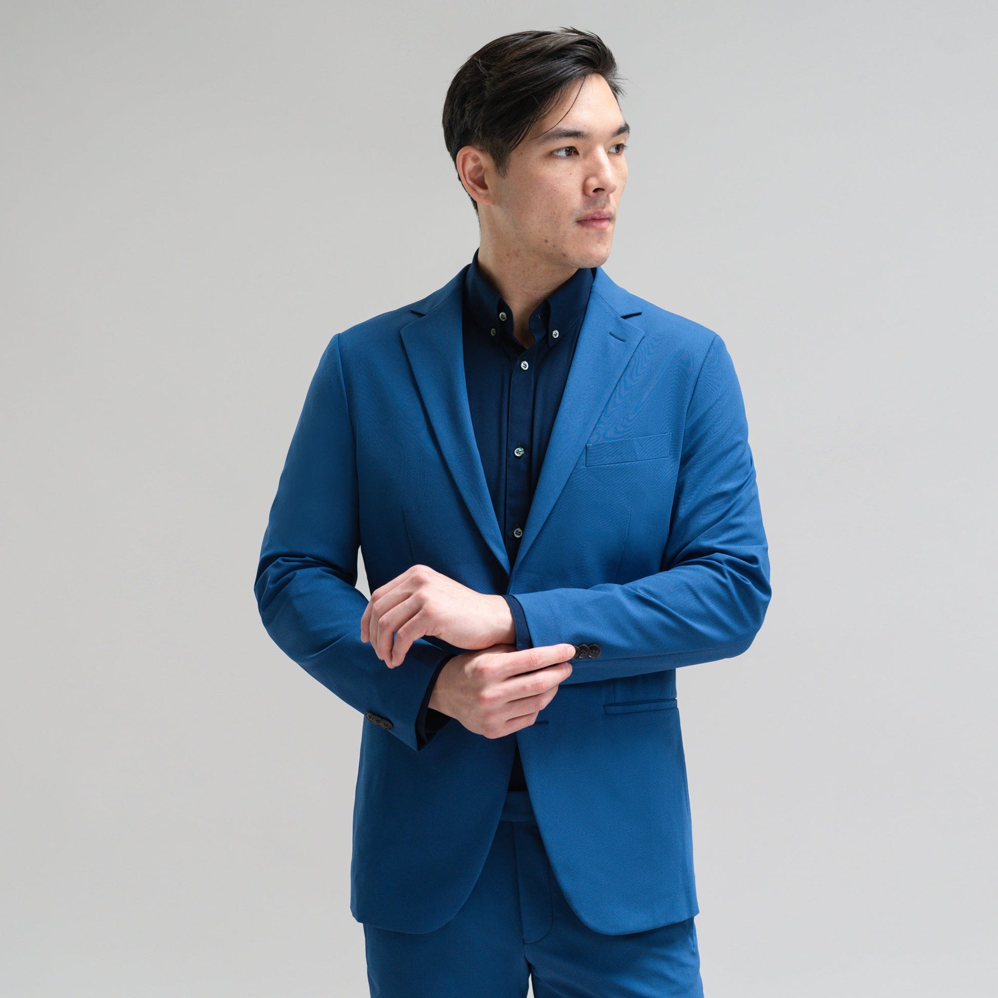Bespoke custom athleisure technical athletic stretch suit los angeles model Jesse in Italian Blue