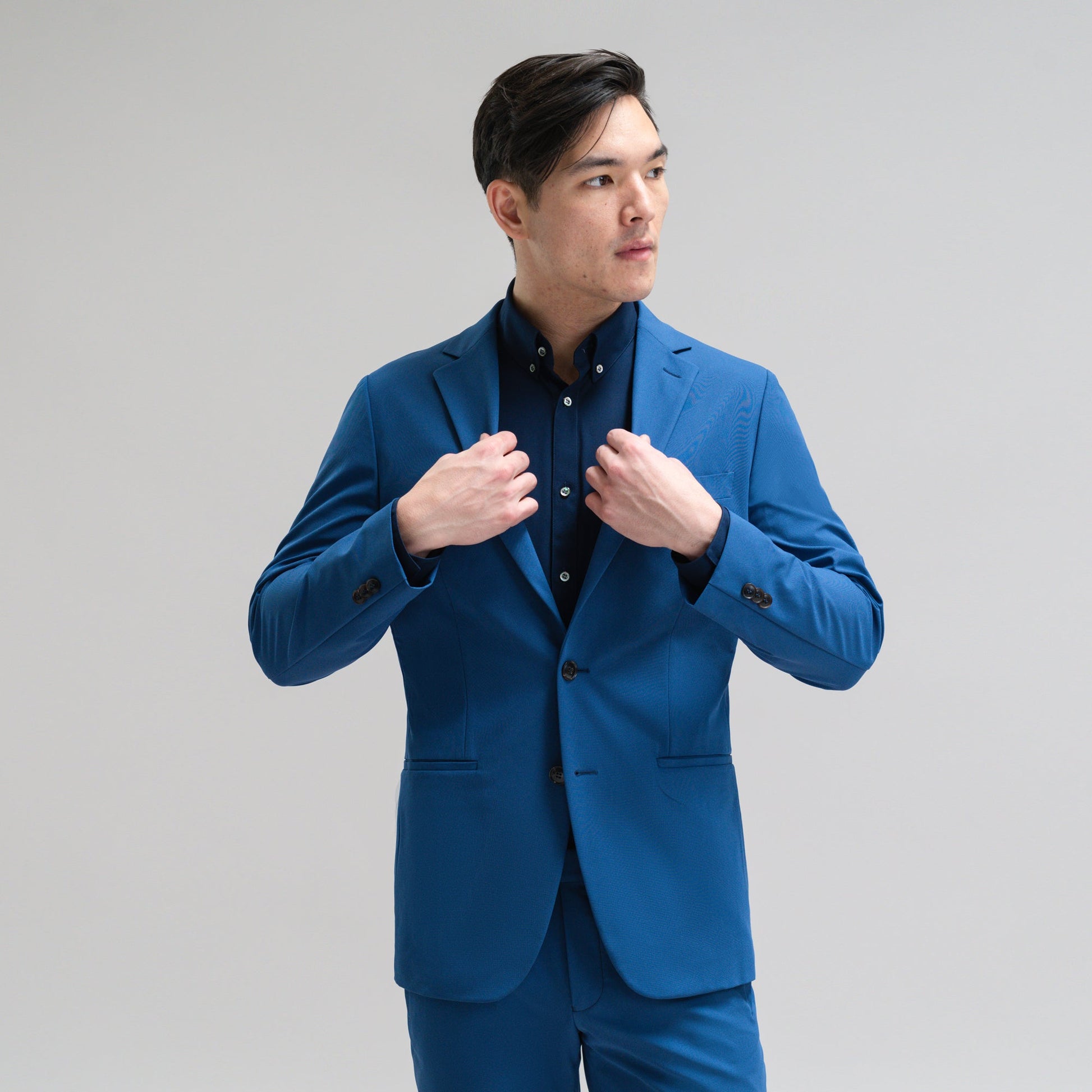 Bespoke custom athleisure technical athletic stretch suit los angeles model Jesse in Italian Blue